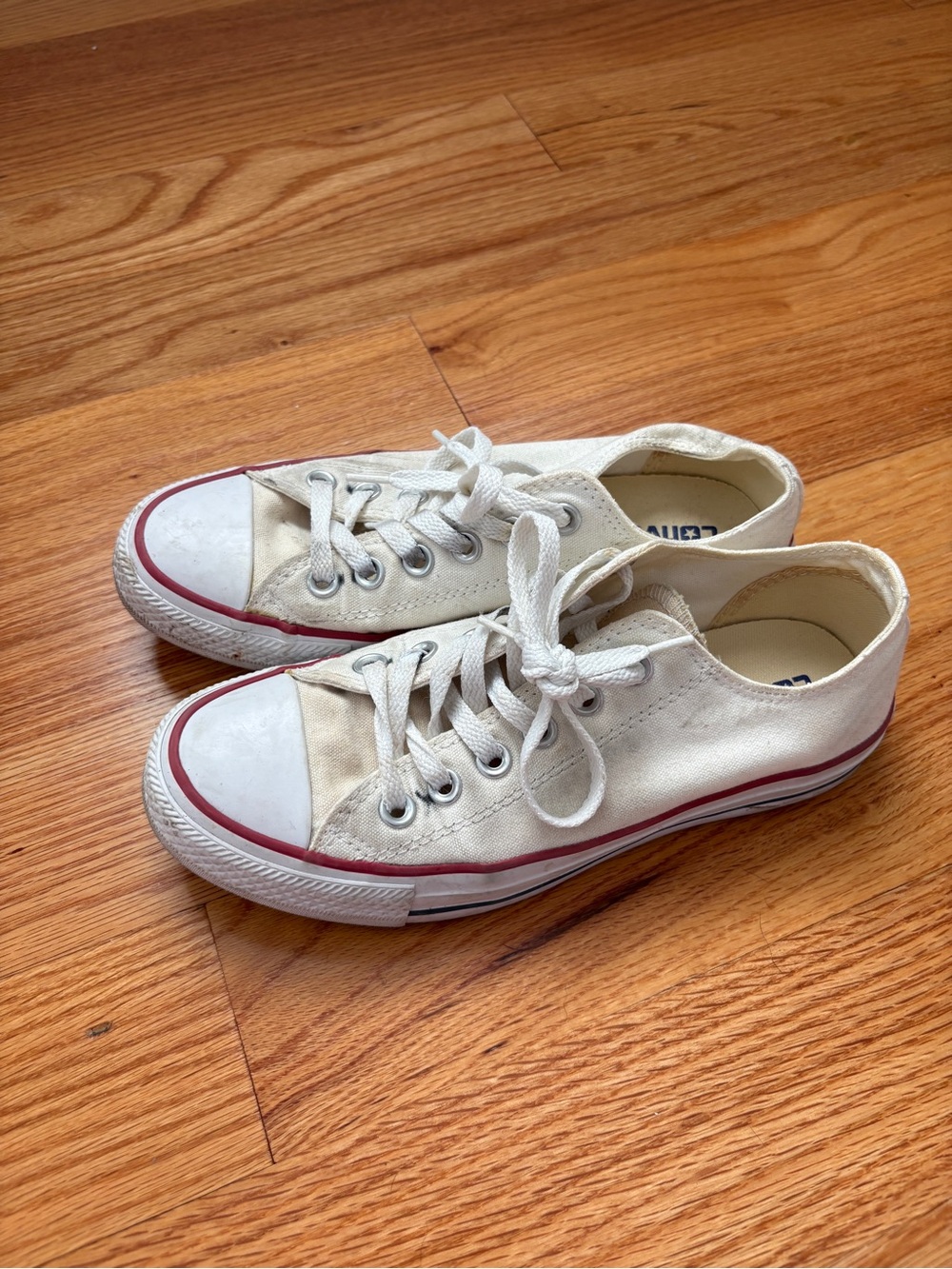 Women’s White Canvas Low-Top Converse Sneakers with Red Trim